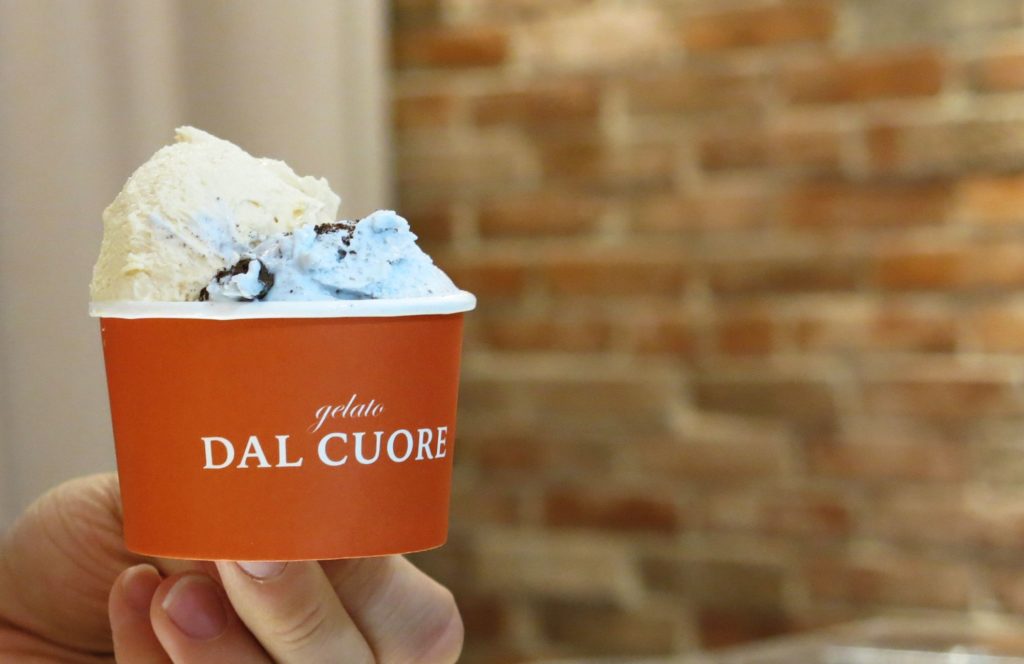 Salted caramel gelato paired with pale blue Milk and cookies gelato from Gelato Dal Cuore.